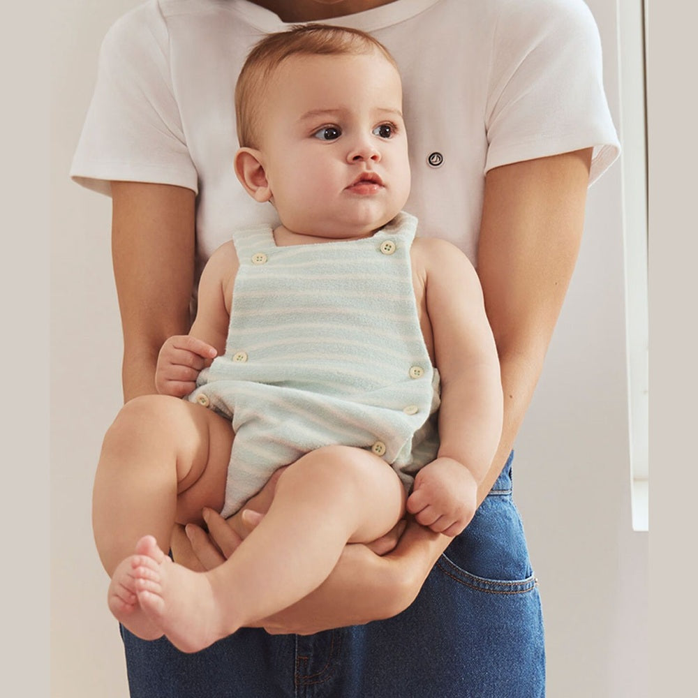 Petit Bateau | Gestreept babyspeelpakje van katoenen badstof